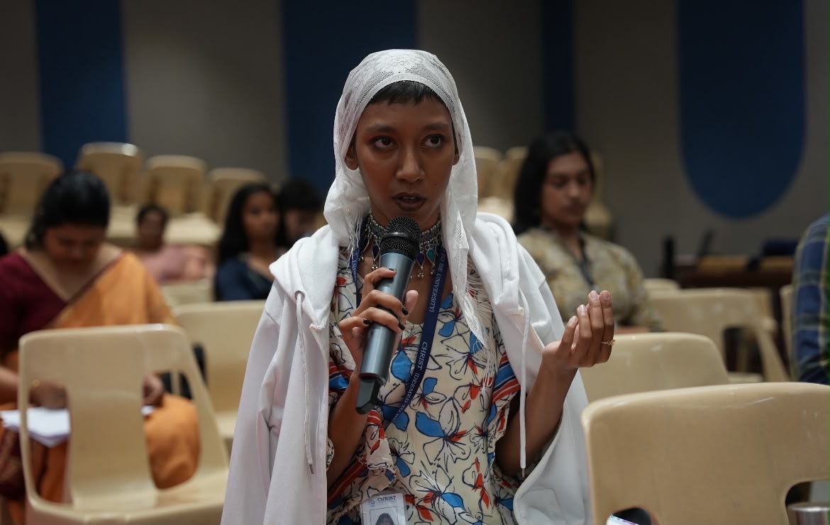 Student speaking into a microphone during a session